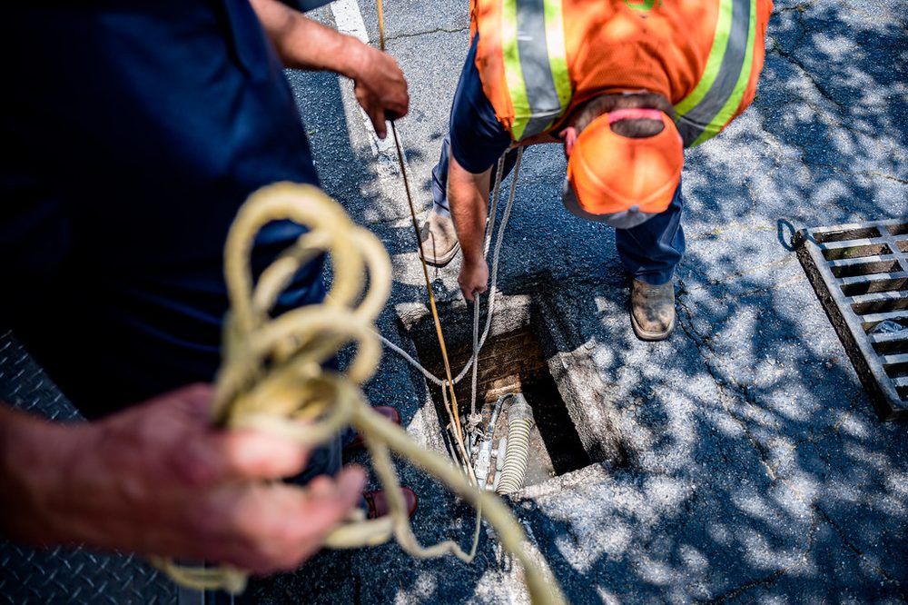 Technician running a sewer inspection camera
